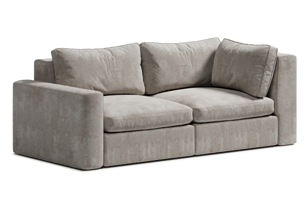 sofa wypoczynkowa z miękkimi poduchami i asymetrią